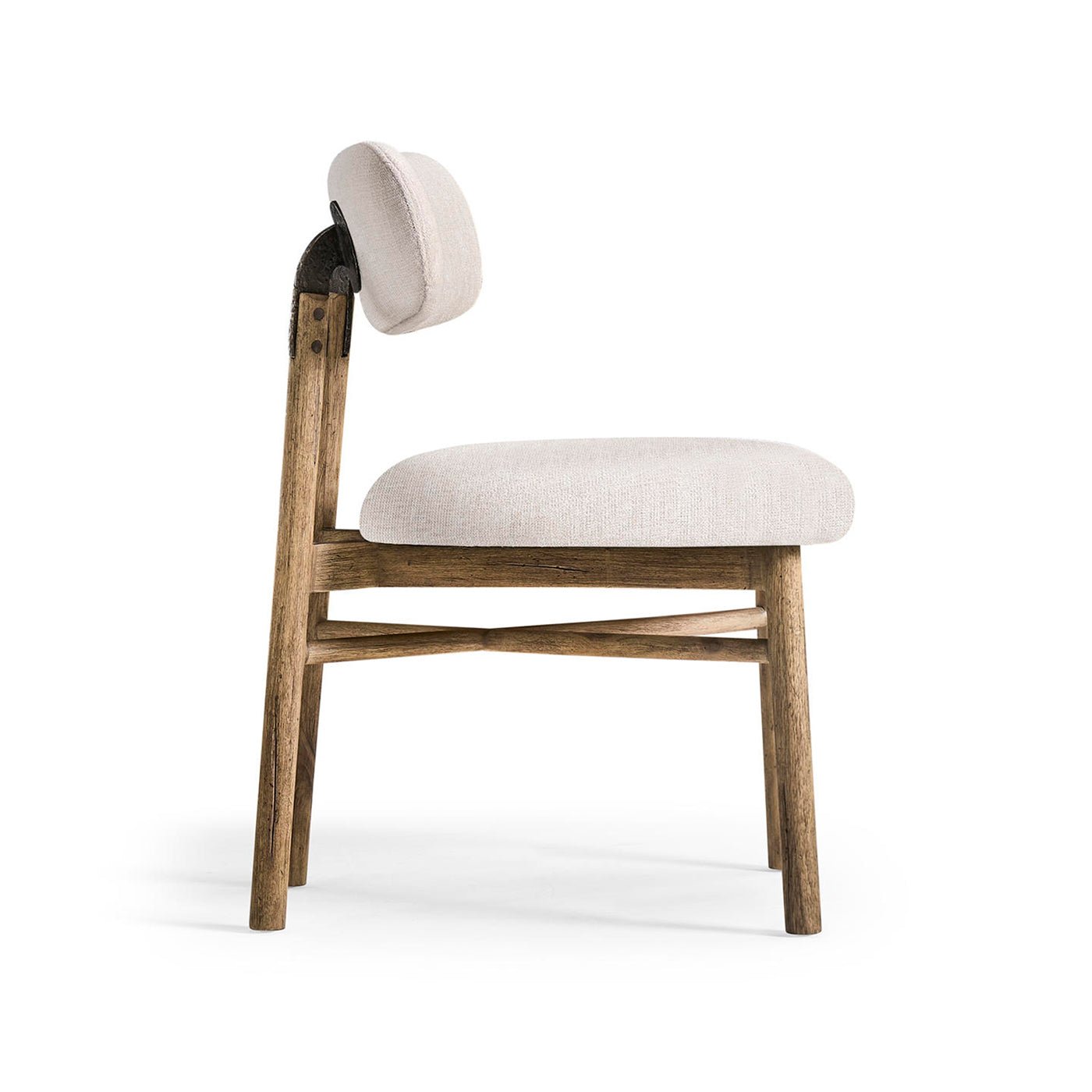 Side profile of upholstered rustic chair, wood legs.