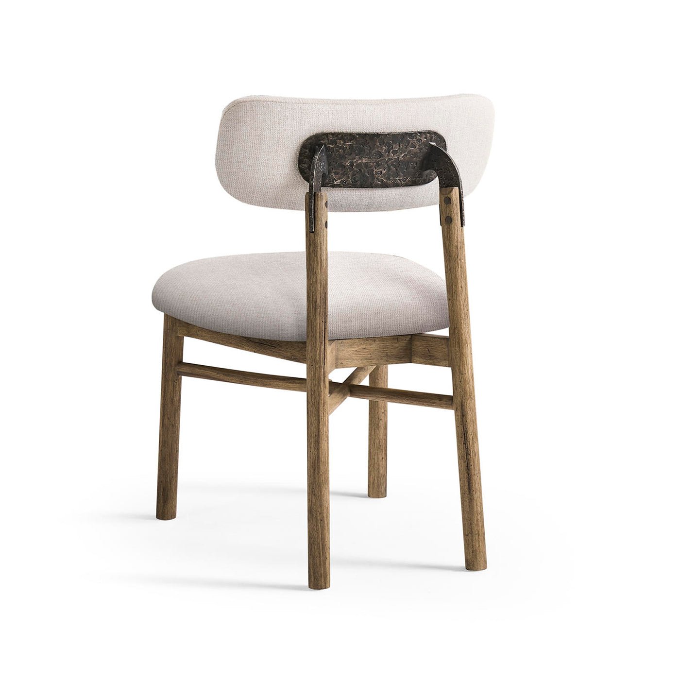 Rear view of rustic upholstered side chair with metal accents.