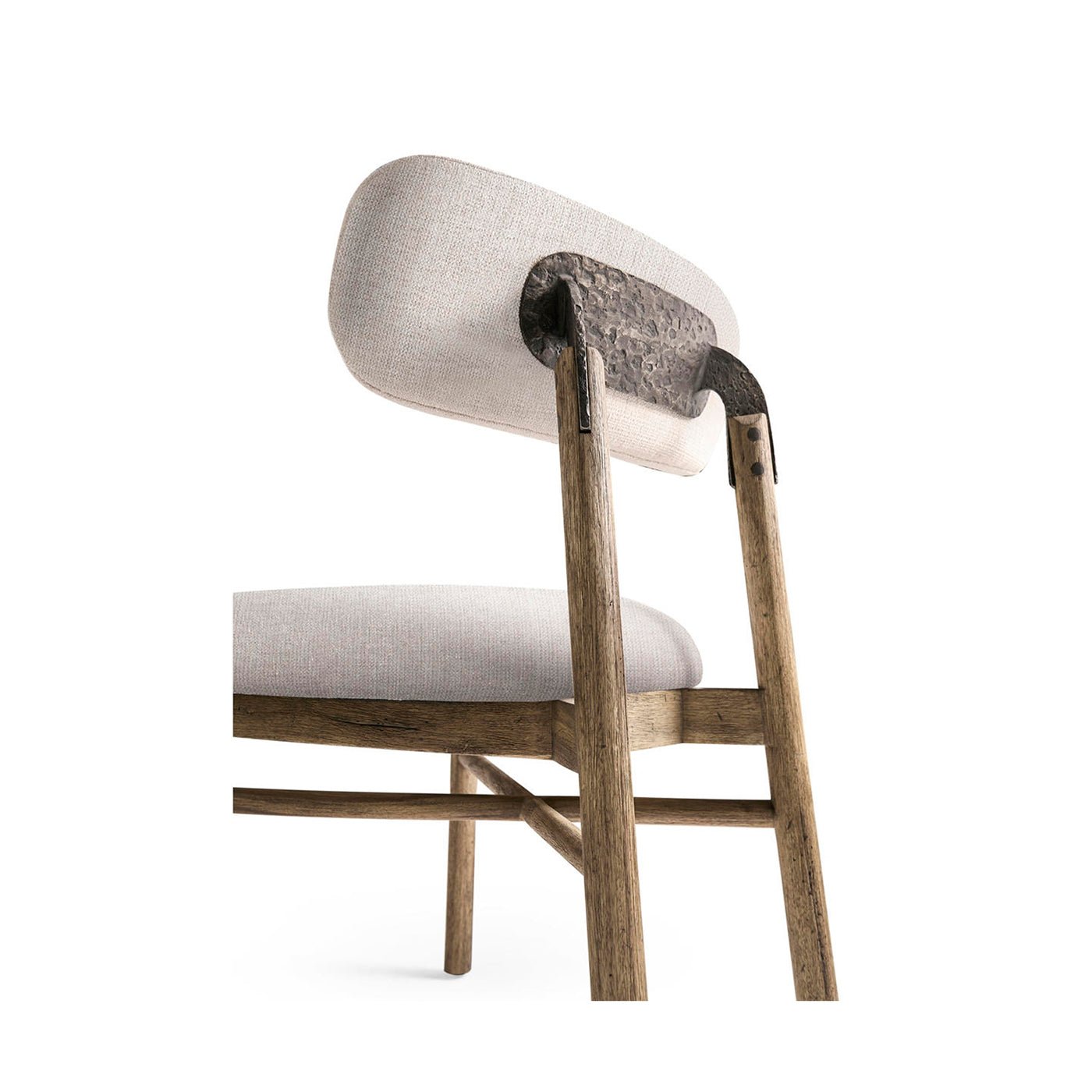 Back detail of rustic chair showing metal support.