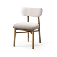 Rustic upholstered side chair, angle view, wood and fabric.