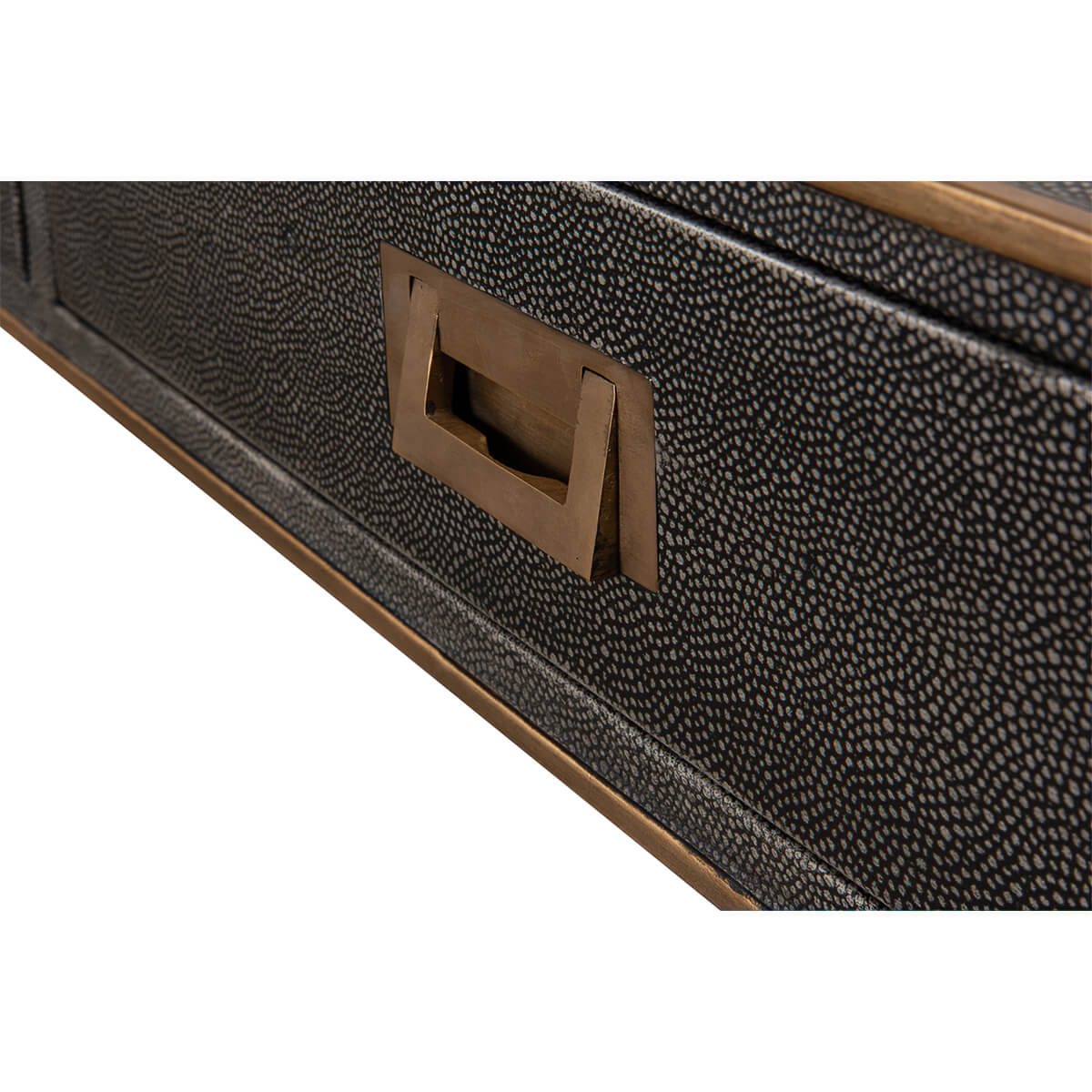 Close-up of drawer handle on modern leather desk.
