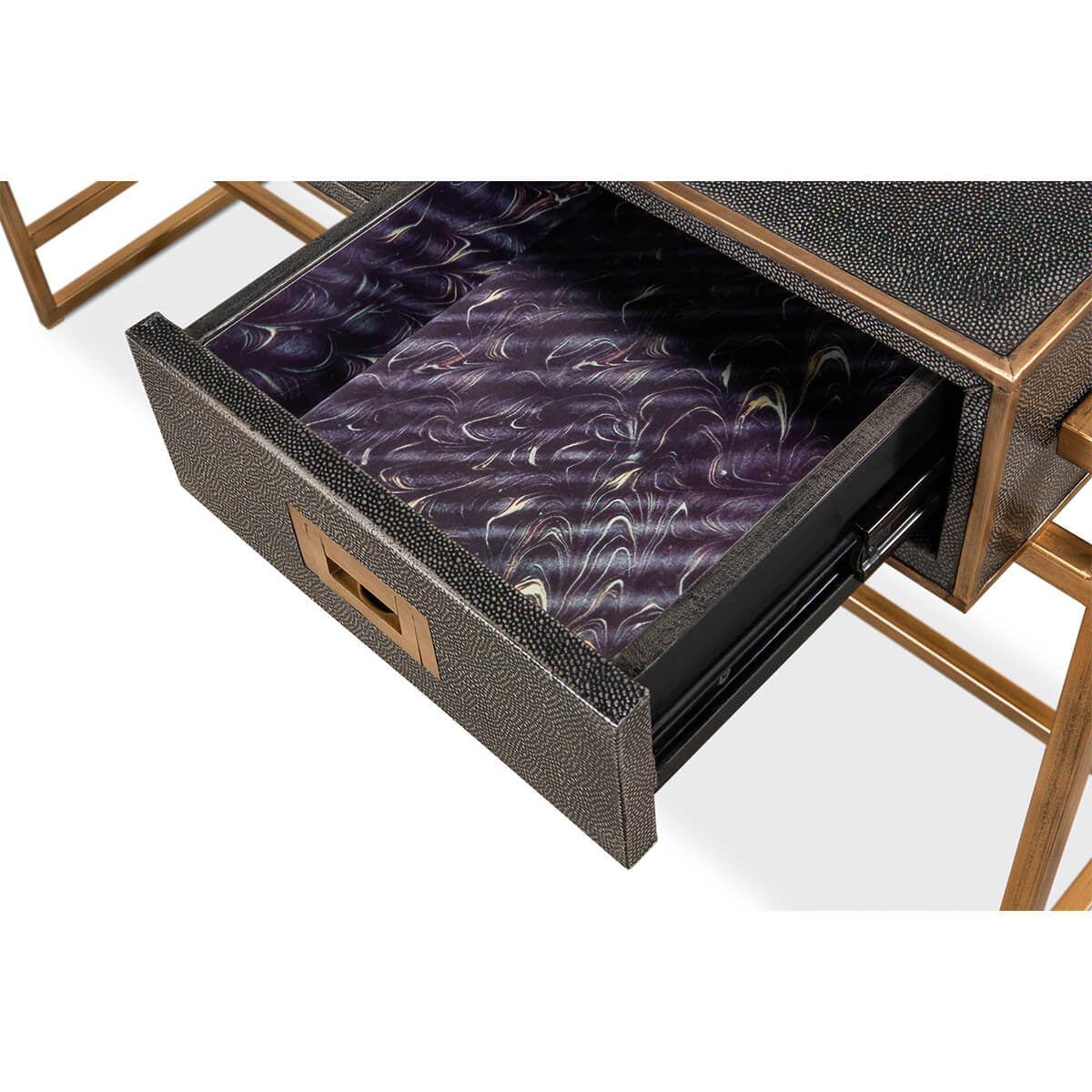 Close-up of drawer interior with decorative lining.