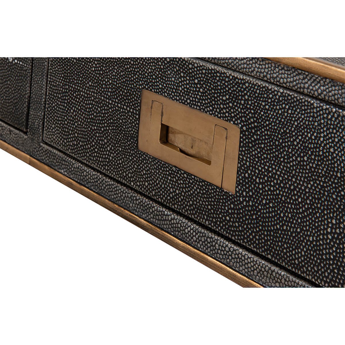 Another close-up of handle on leather desk drawer.