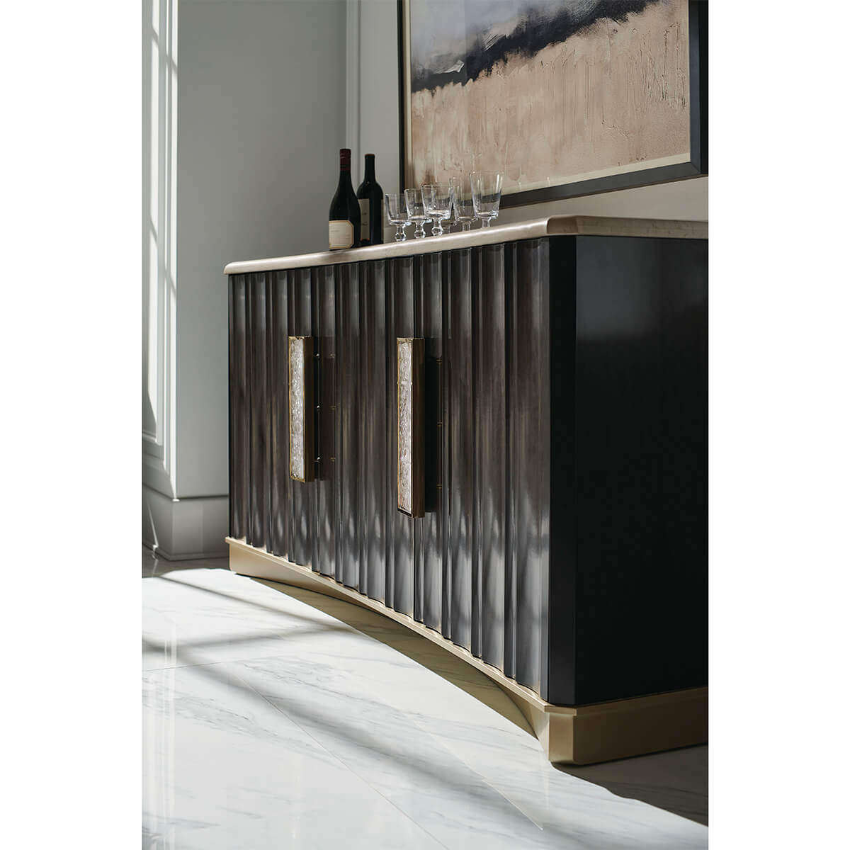 Modern stone top buffet in elegant room setting.