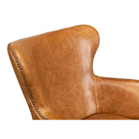 Brown leather desk chair, armrest and back detail.