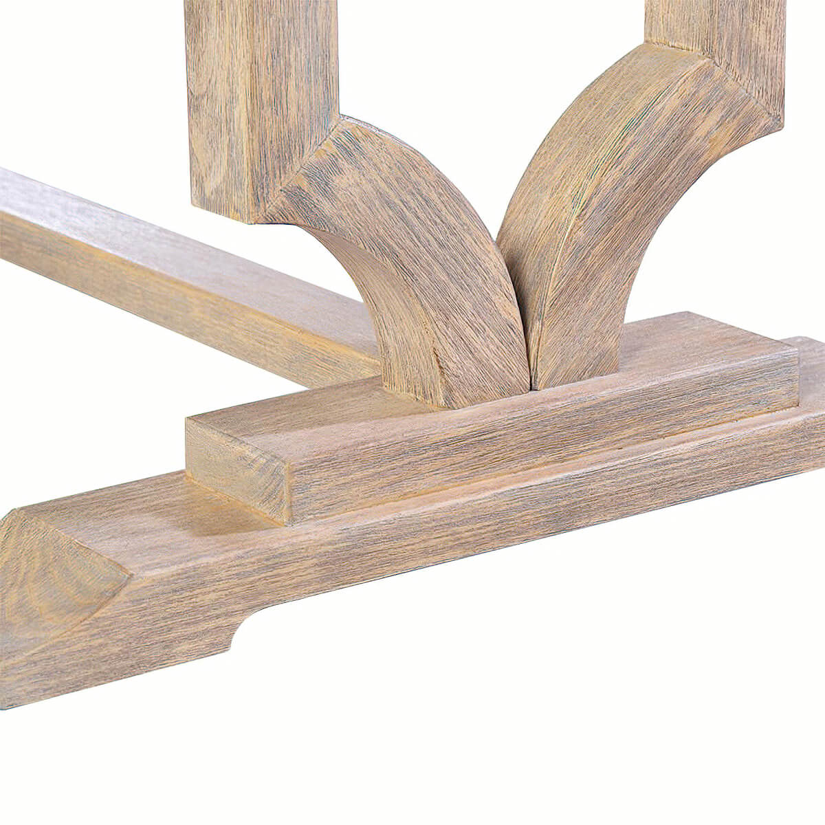 Detailed close-up of trestle table base design.