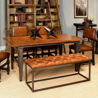 Leather bench at dining table with chairs.