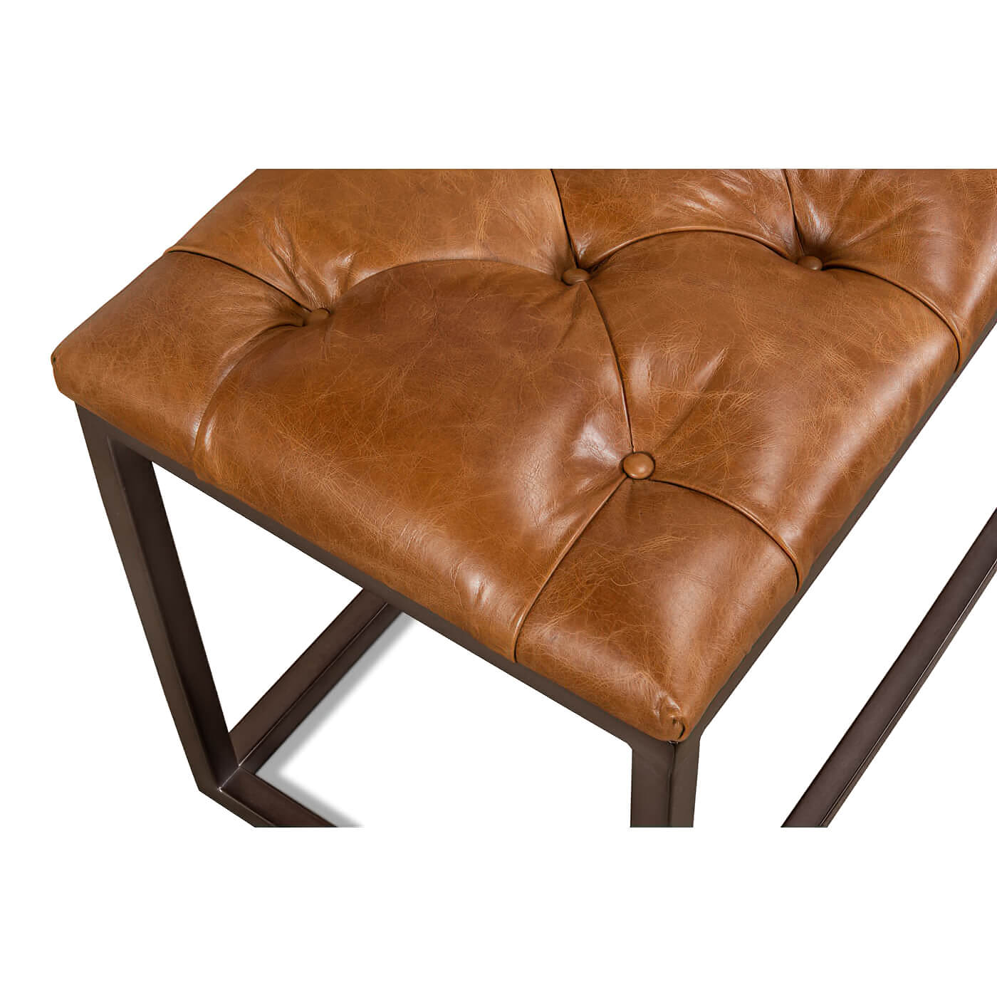 Close-up of tufted leather bench corner.