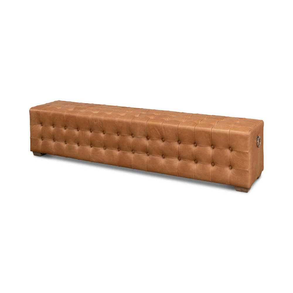Long modern tufted leather bench, three-quarter view.
