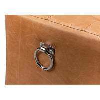 Close-up, metal handle on tufted leather bench.