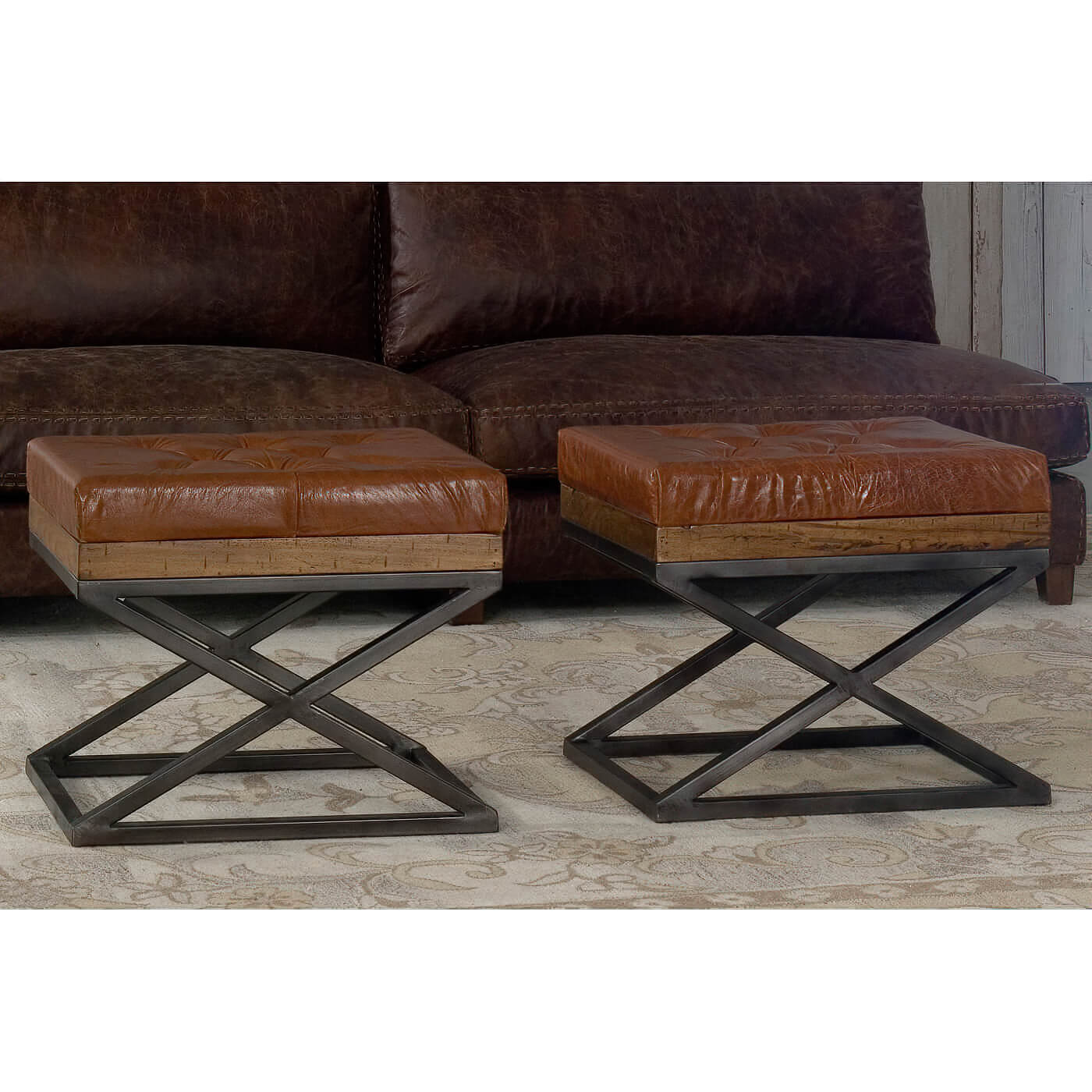 Pair of modern tufted leather stools in living room.