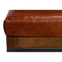 Close-up of leather and wood details on stool.