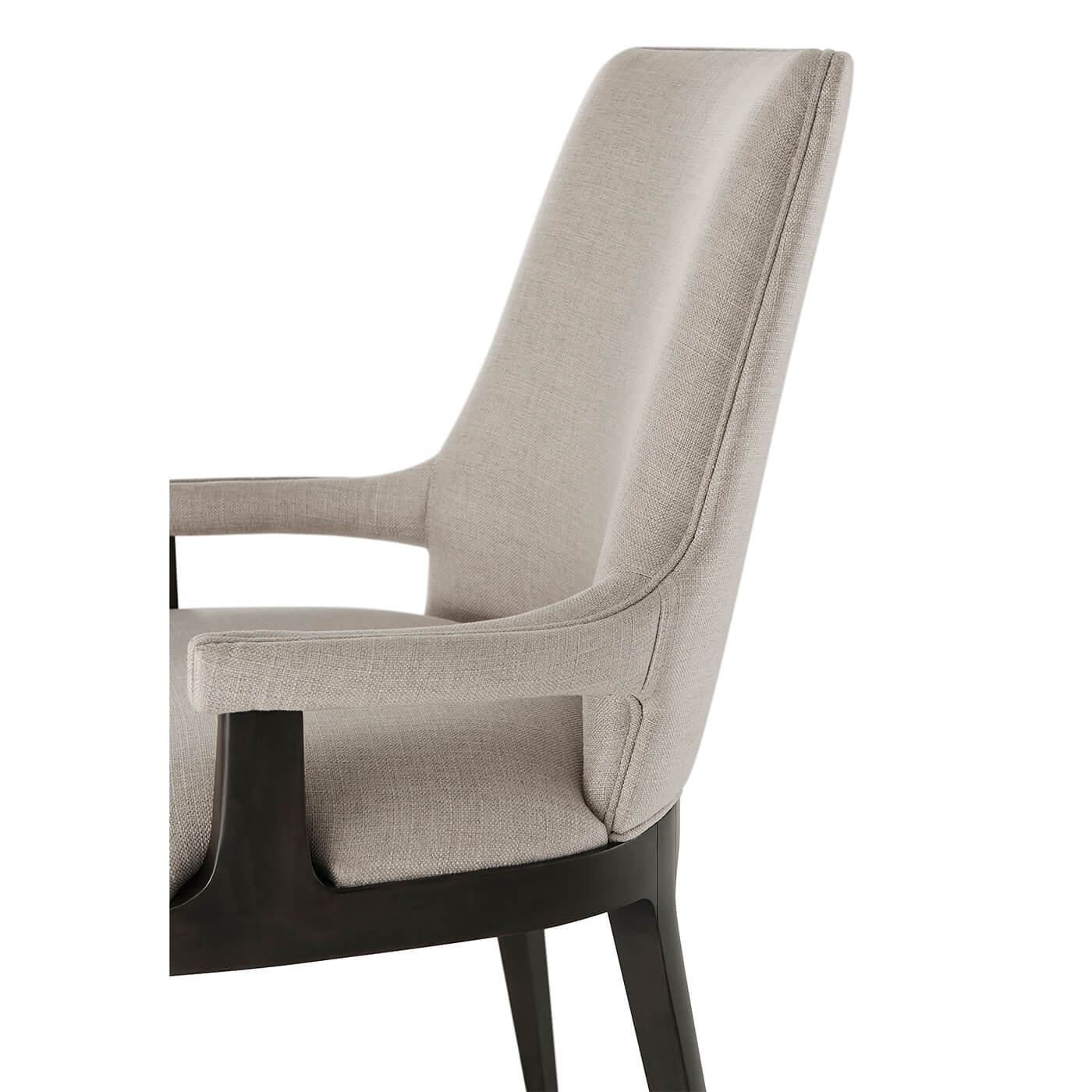Close-up modern dining chair, detailed upholstery stitching on side.