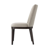 Side view of modern upholstered dining side chair.