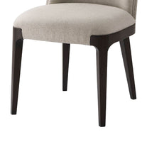 Close-up of legs on modern upholstered dining side chair.