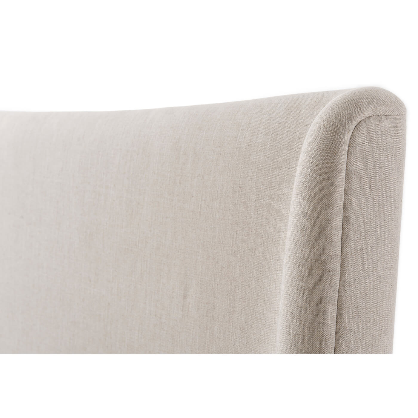 Detail of modern upholstered bed headboard corner.