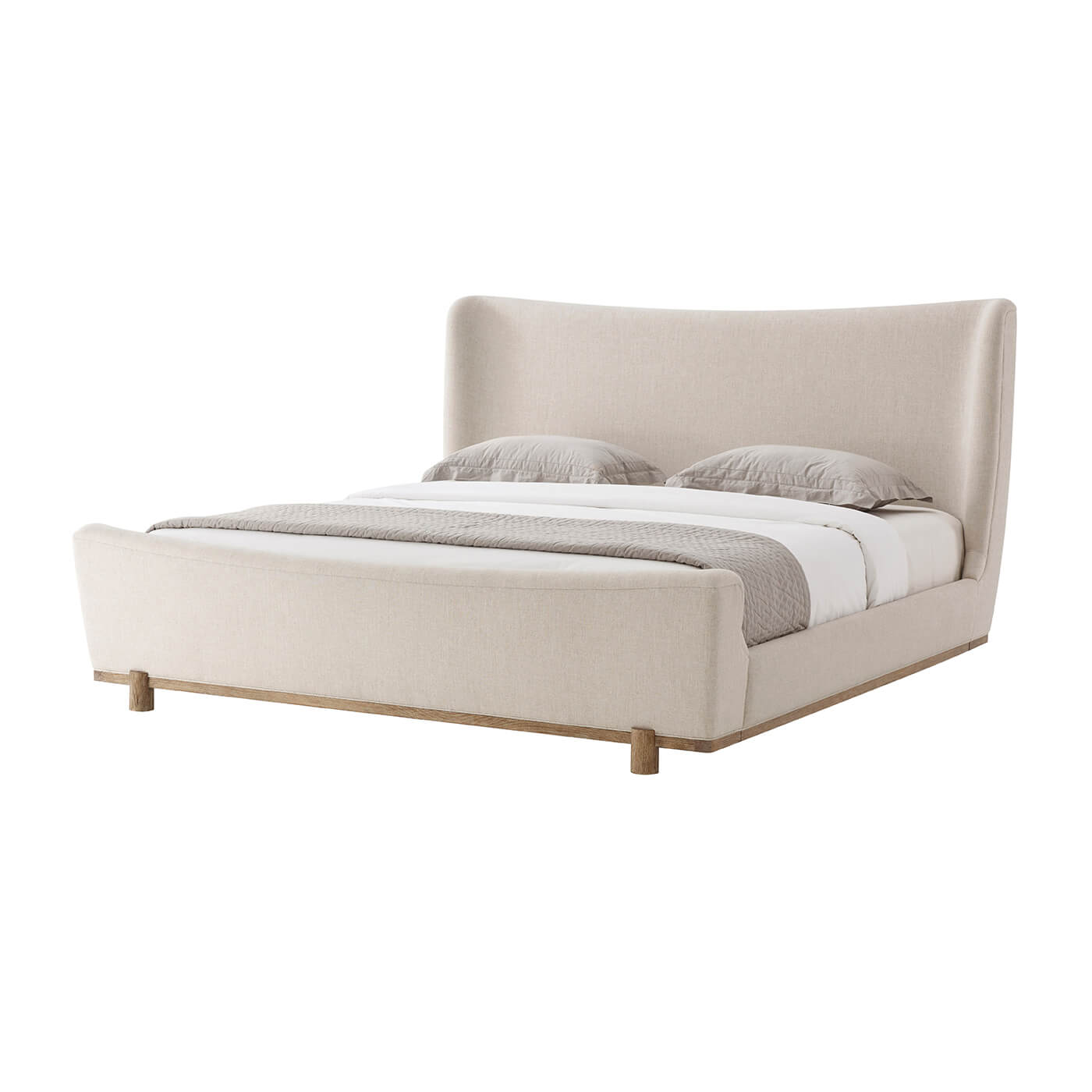 Modern upholstered king size bed with bedding, side view.