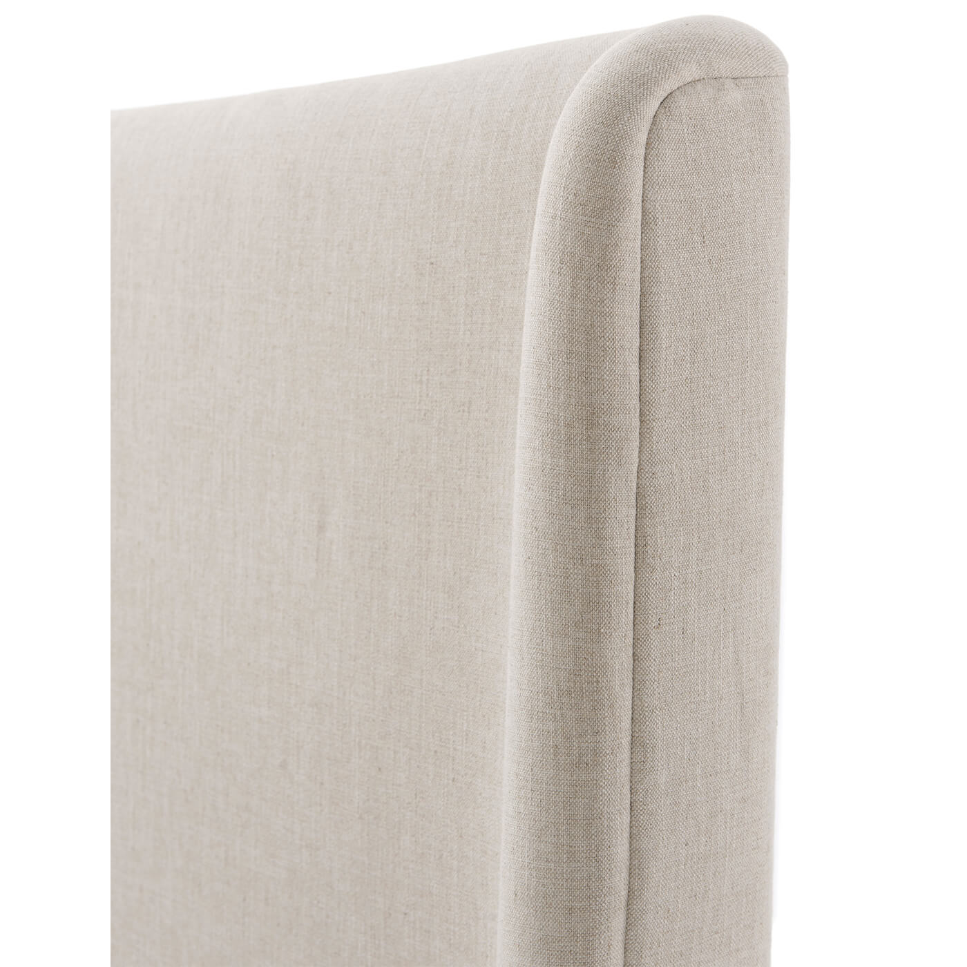 Close-up of modern upholstered bed headboard detail.