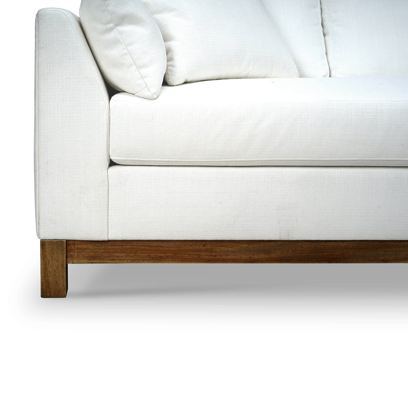 Close-up of sofa's wooden base and upholstery.