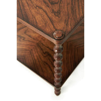 Close-up of walnut table corner and spindle leg detail.