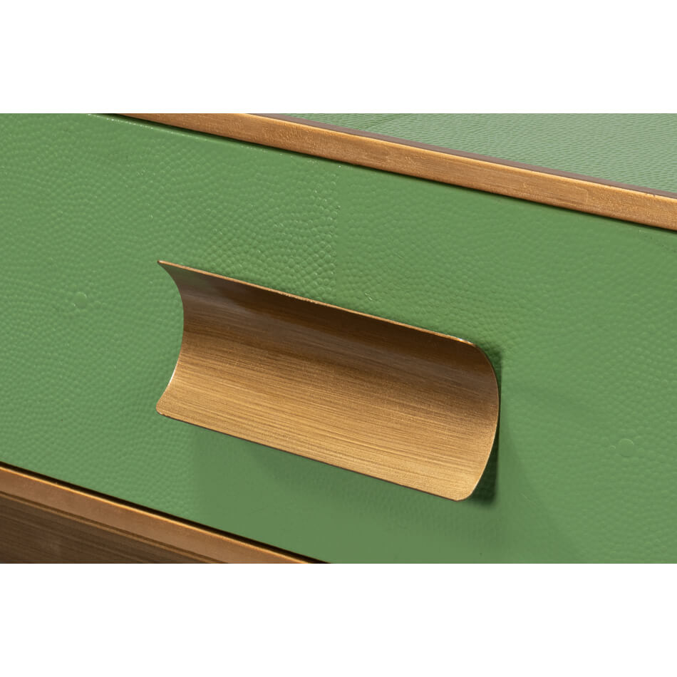 Close-up of console table drawer handle with gold finish.