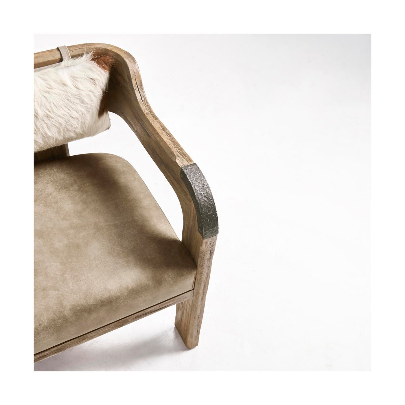 Close-up of armchair armrest and cushion texture.