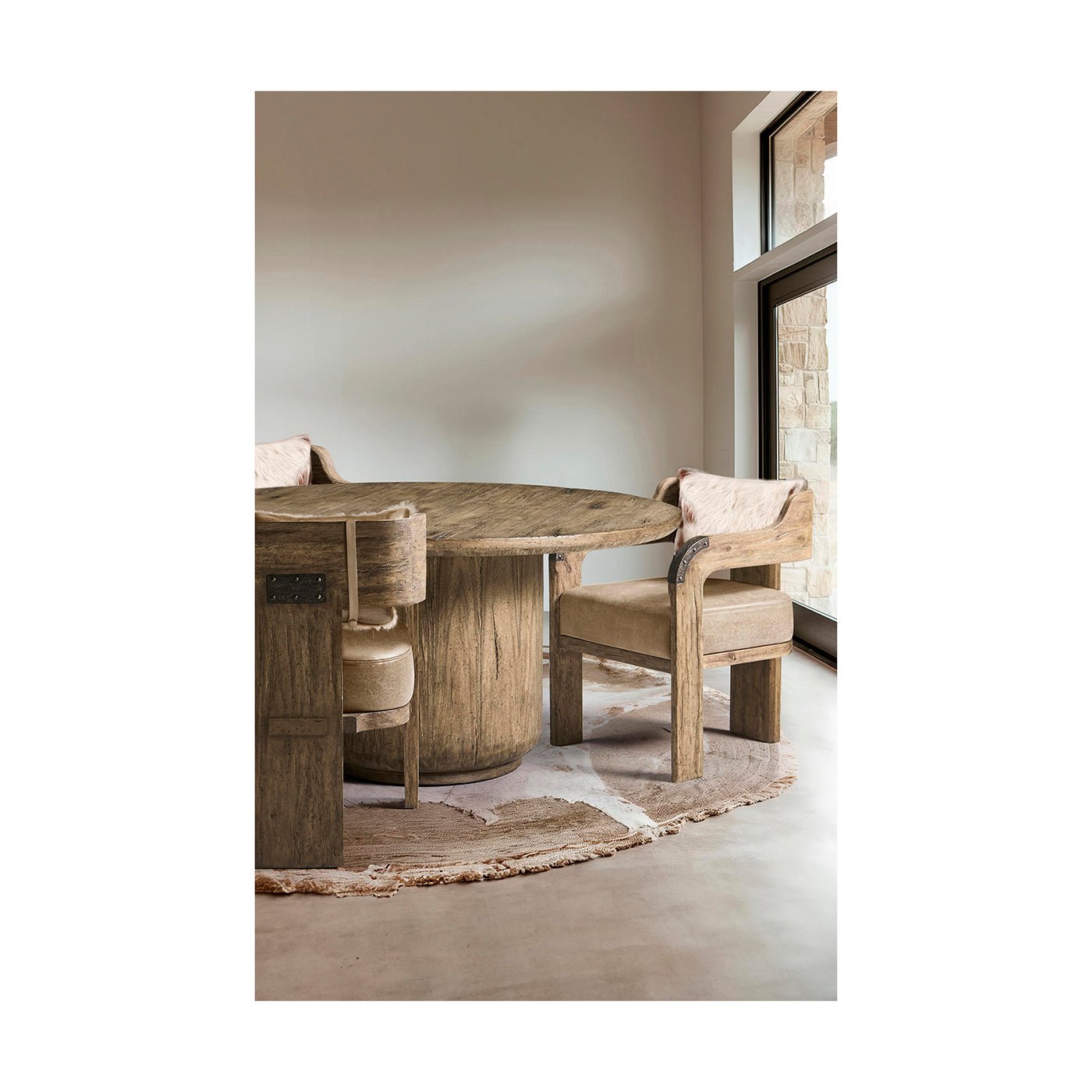 Dining chairs set around round table in cozy room.