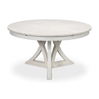White oak dining table, partially closed with pedestal base.