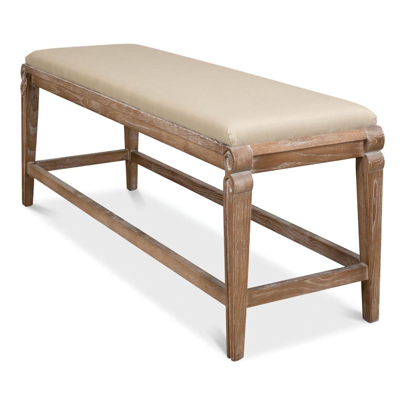 Angled side view of linen upholstered bench.