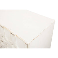 Close-up corner of whitewashed sideboard.