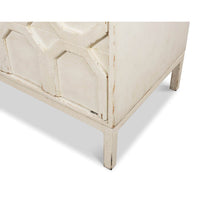 Bottom corner detail of white sideboard legs.