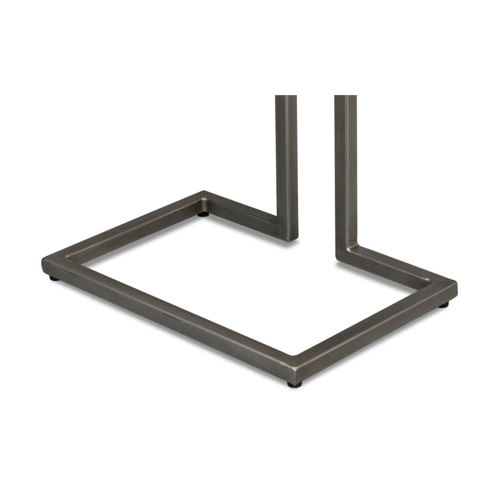 Modernist accent table, close-up of metal base structure.
