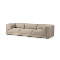 Angled front view of beige three-piece modular sofa with broad cushions and square track arms
