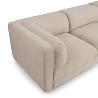 Overhead detail of beige modular sofa arm, seat cushion and back cushion