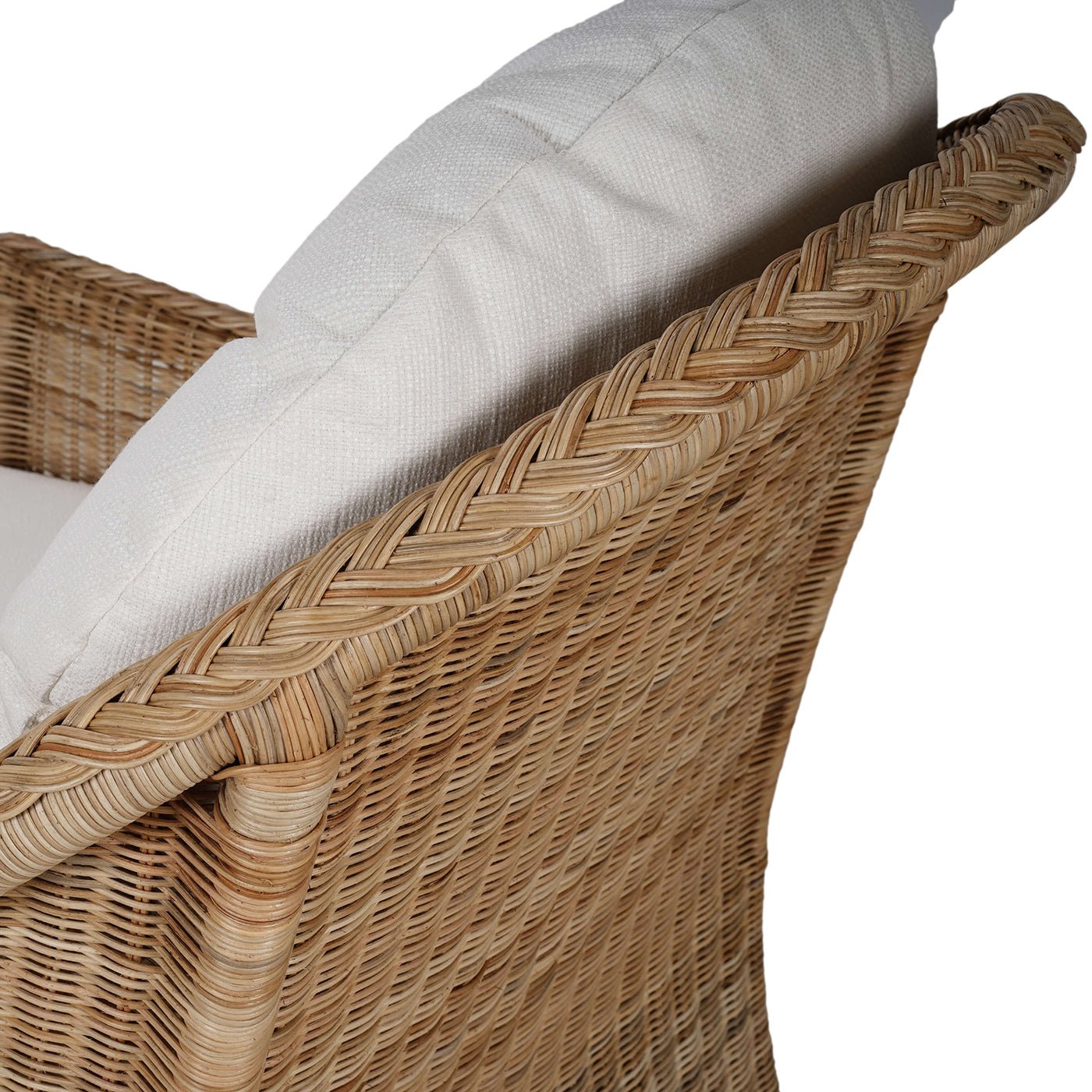 Side angle of chair arm and cushion details.