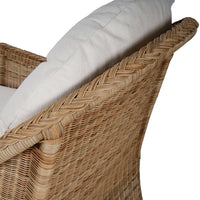 Side angle of chair arm and cushion details.