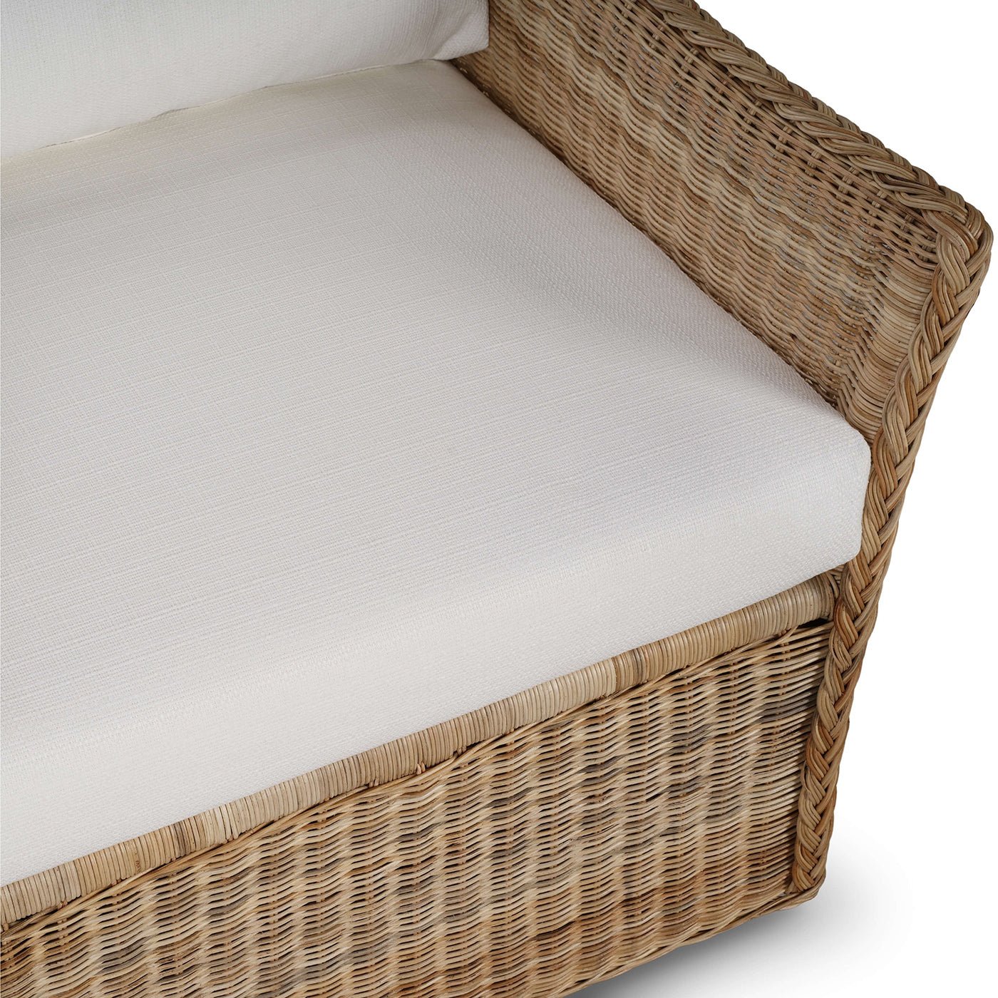 Top view of rattan chair's seat cushion and arm.