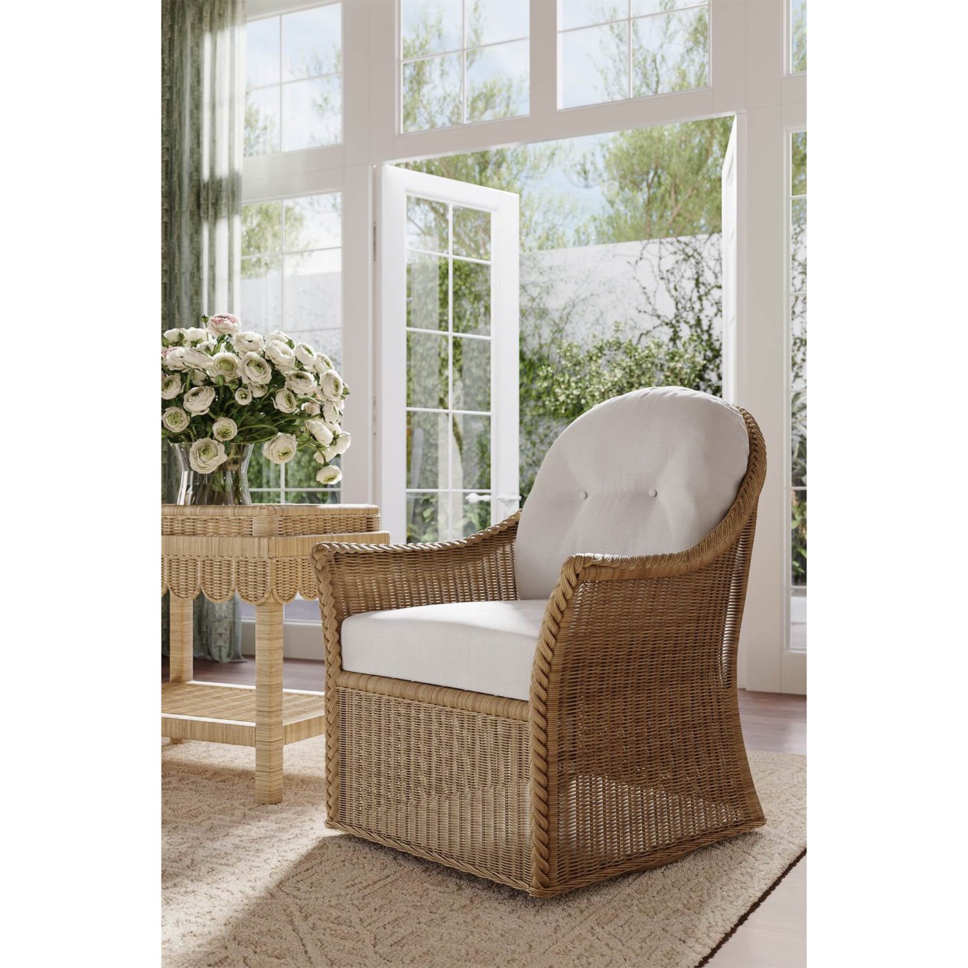 Rattan swivel chair in sunlit room setting.
