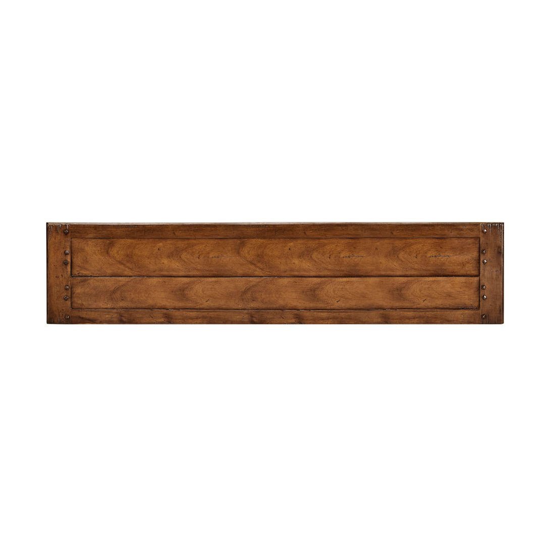 Top view of narrow walnut sideboard surface.
