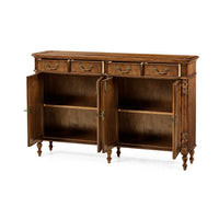 Open doors of walnut sideboard showing shelves.