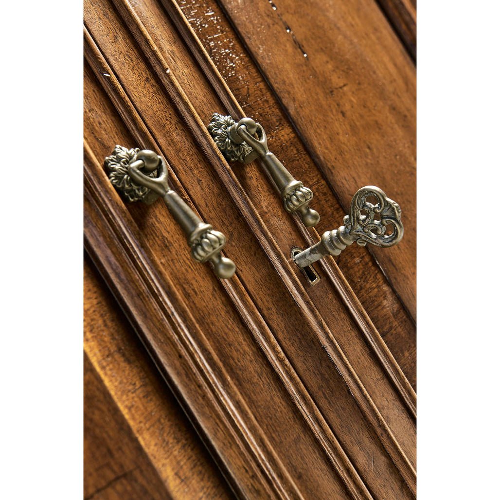 Key and lock detail on walnut sideboard door.