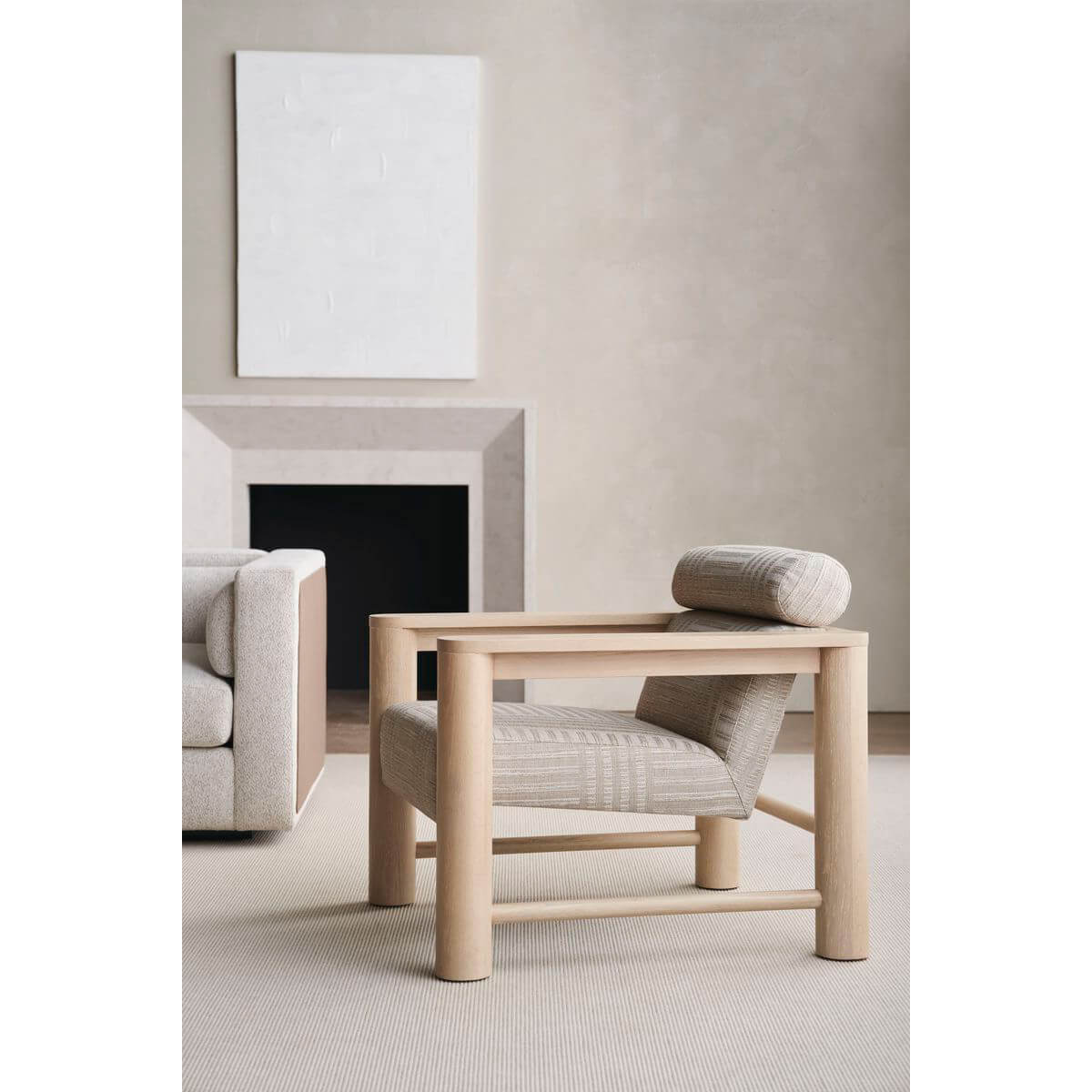 Natural oak arm chair in modern living room setting.