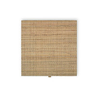 Top view of natural rattan bedside table surface.