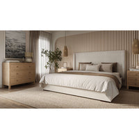 Bedroom with rattan bedside table by bed.