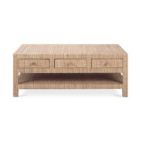 Front view of natural rattan coffee table, closed drawers.