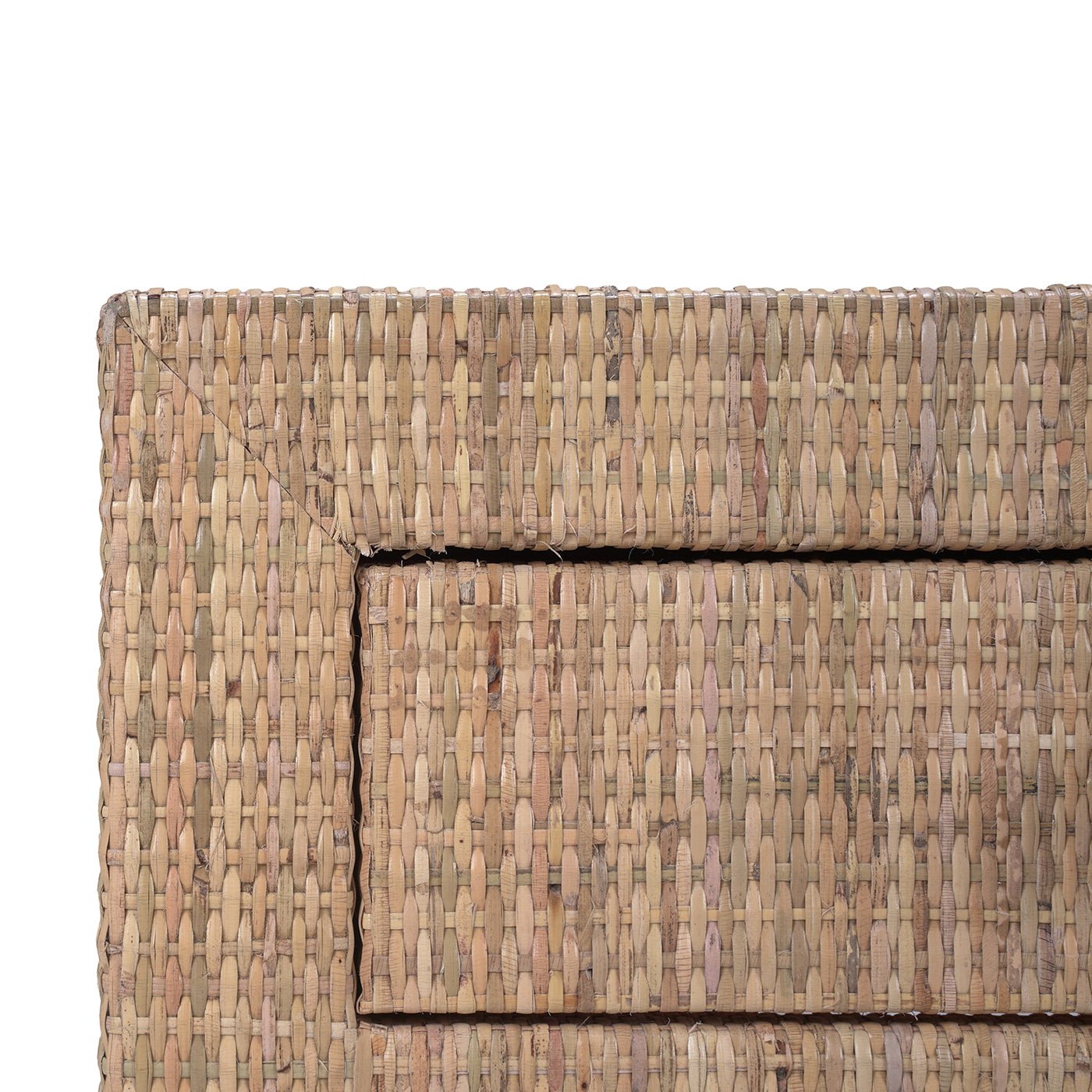 Close-up of rattan texture on coffee table's corner.
