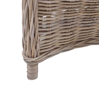 Close-up of natural rattan chair leg details.