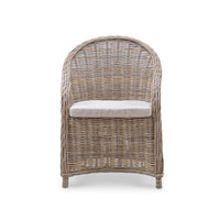 Front-facing natural rattan dining chair detail.