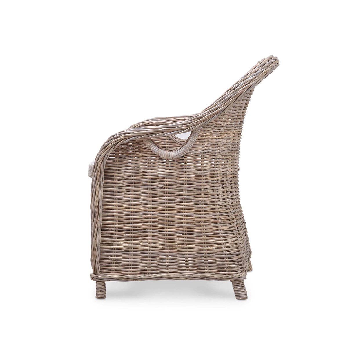Side profile of natural rattan dining chair.