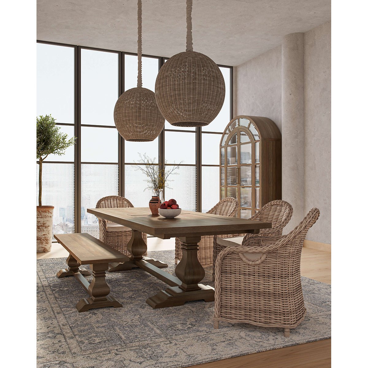 Dining room with rattan chairs and wooden table setup.